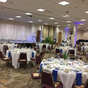Round banquet tables and a stage