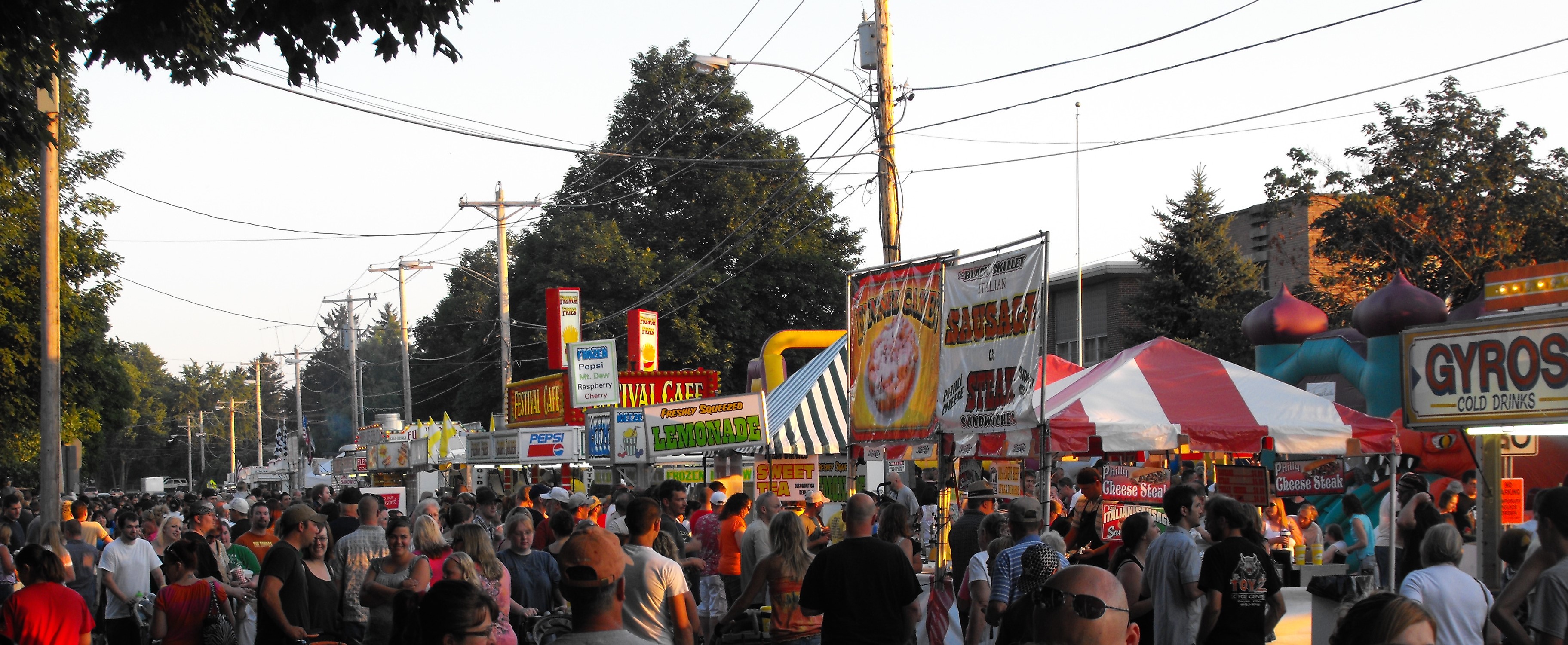 Crowded street lined with food vendors